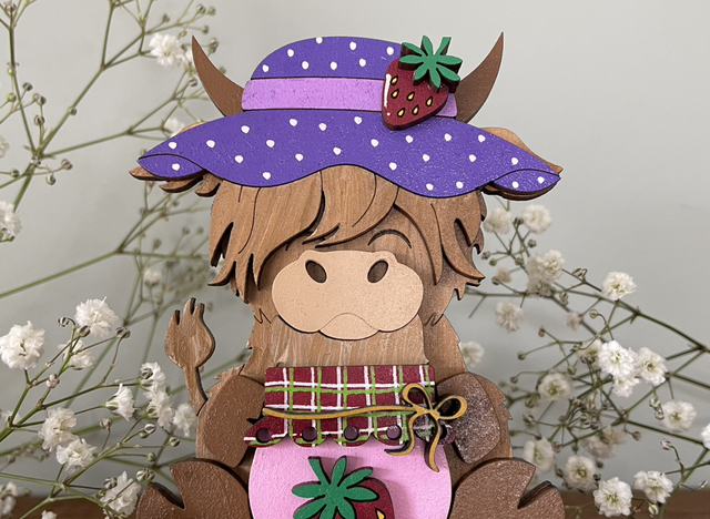 Highland Cow with strawberry 