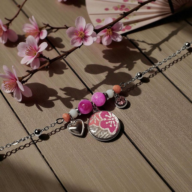 bracelet acier inoxydable motifs japonais rose et argenté