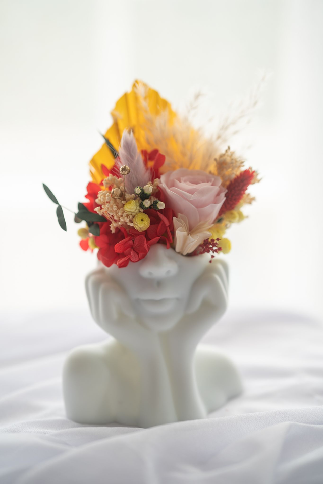 Composition vase visage