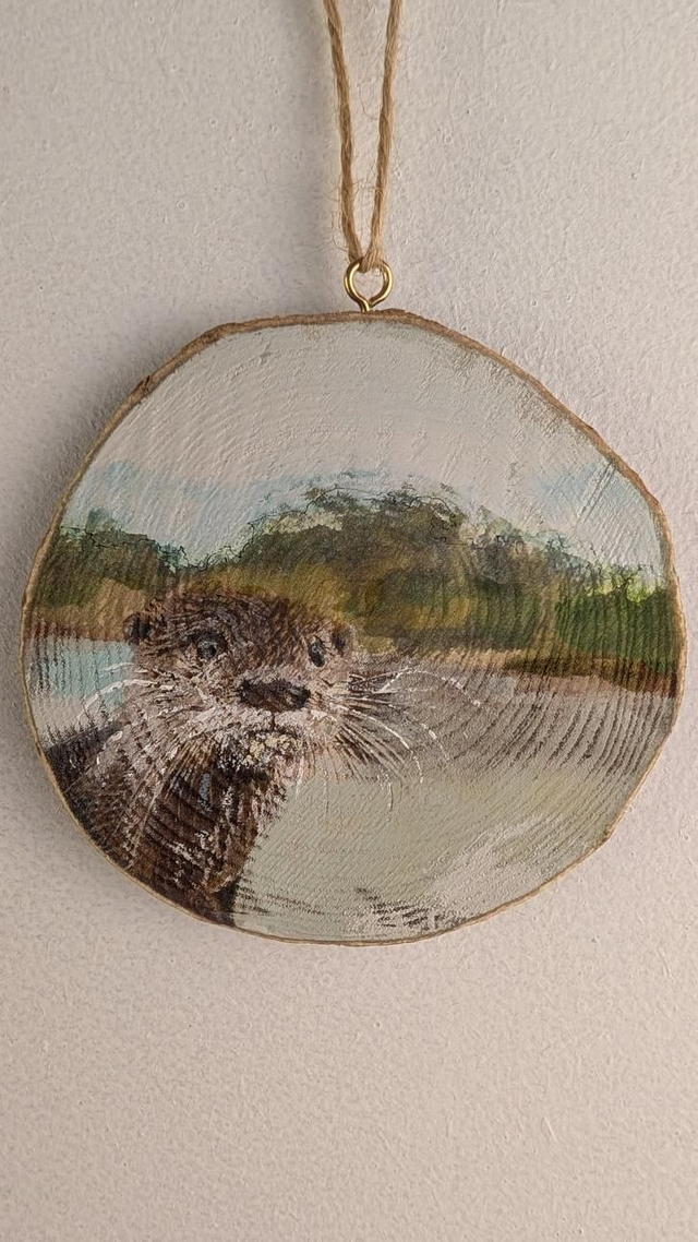 Otter by the river bank - Log Slice