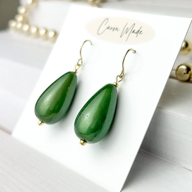 Light reflecting green teardrop miracle bead earrings