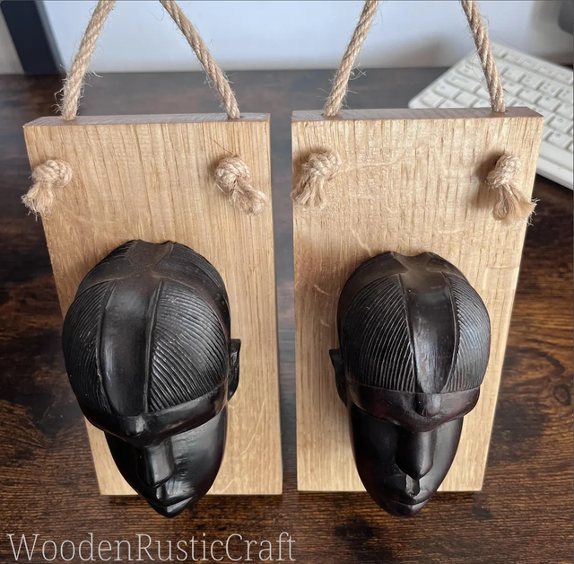 Pair of Ebony Head Sculptures on Oak Wall-Mounting Bases