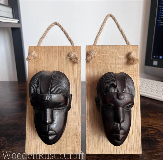 Pair of Ebony Head Sculptures on Oak Wall-Mounting Bases
