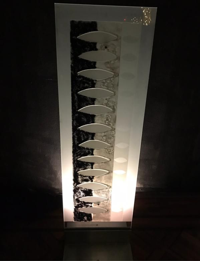 12 Glasobjekt „ellipse" schwarz.weiß. 35 x114 cm 