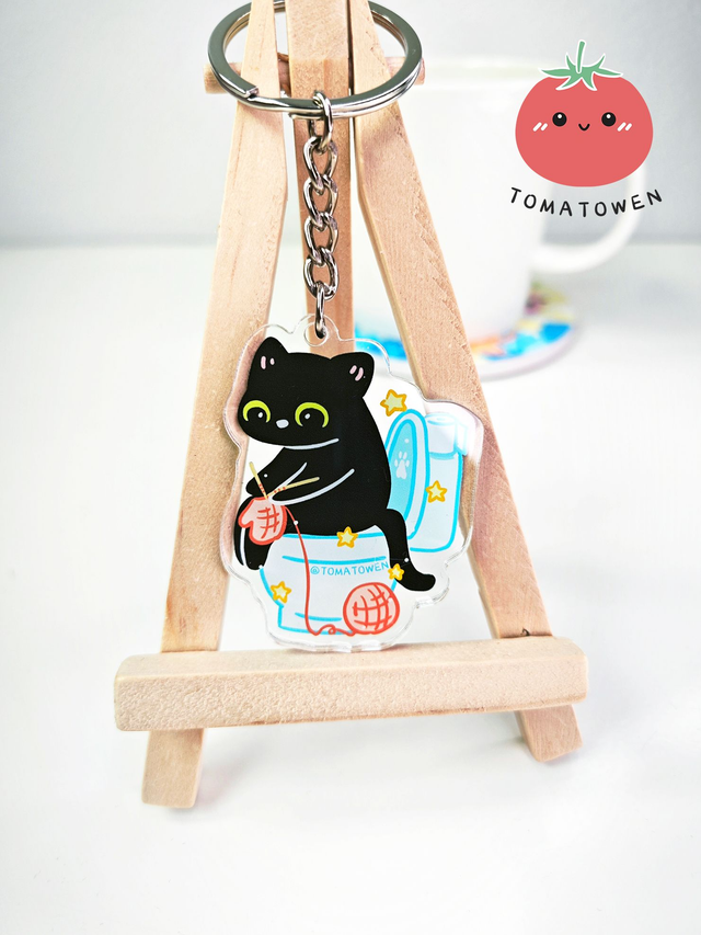 Keychain: Black cat knitting on toilet