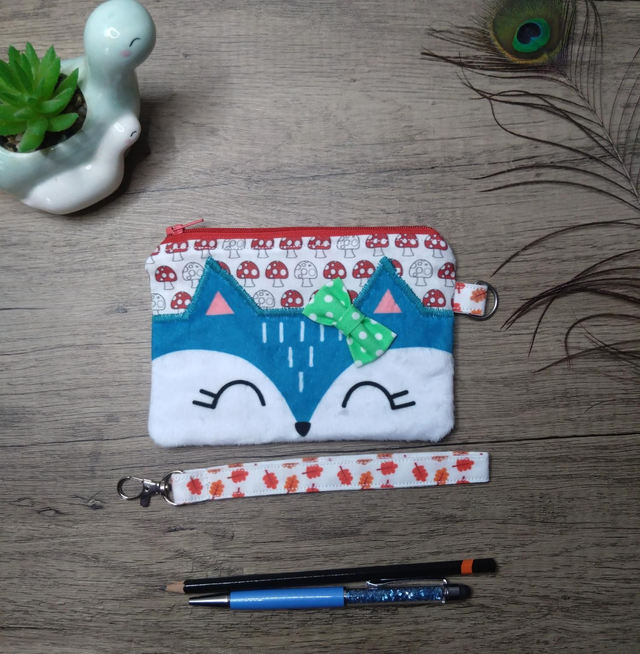 Blue fox zip purse with wrist strap 