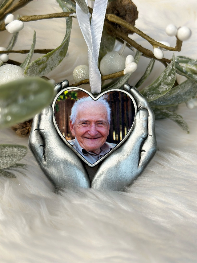 Beautiful metal hands holding a photo of your loved one decoration