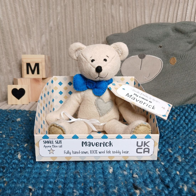 Maverick. Small size, handmade teddy bear. UKCA. Tray base packaging. Standard Wool Felt. Beige. Bold blue. Sand. Stone grey.