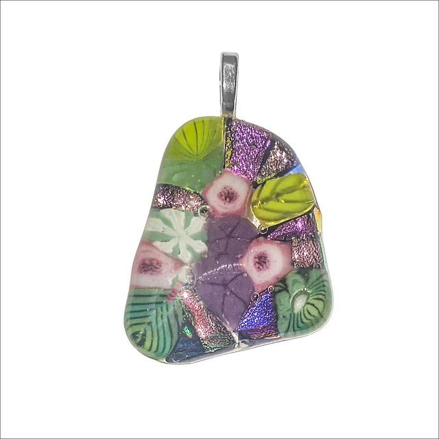 Pendant in fused glass with a mix of green murine leaves, white, pink and purple flowers and hint of dichroic glass sparkle (Ref P32)