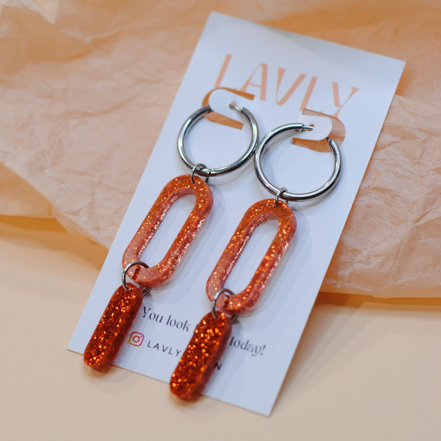 Välke-korvakorut, oranssi glitter, teräs