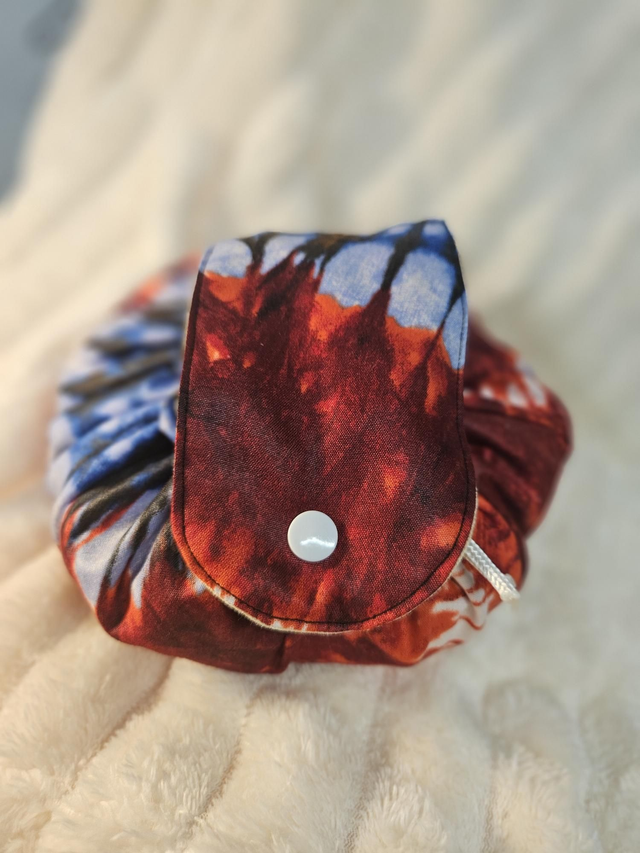 Bourse à maquillage "wax bleu rouge"