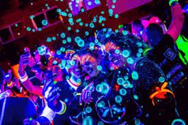 UV Bubble machine with disco lights and bubble solution  