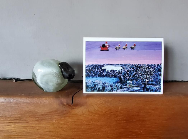 Father Christmas and his flying sheep over the White Horse, Kilburn on North York Moors. A6 card.