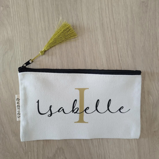 Trousse plate avec pompon assorti