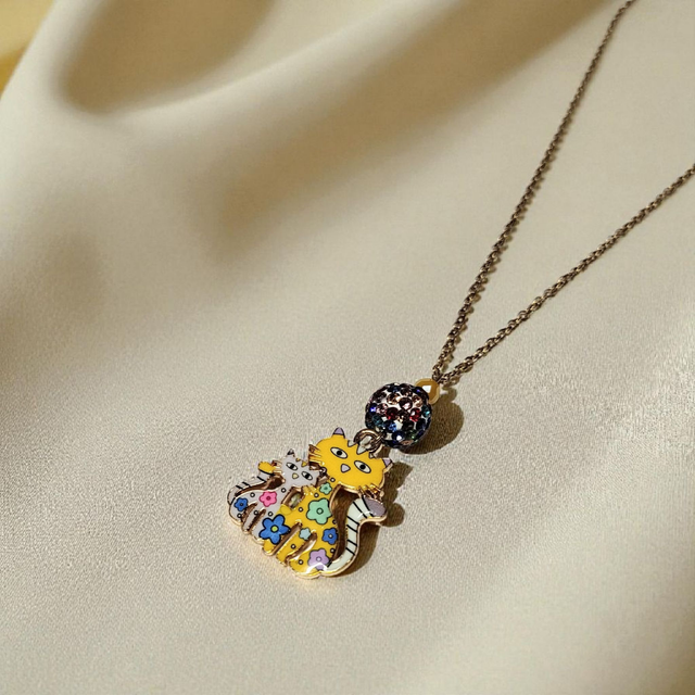 Collier acier inoxydable et cristal jaune et blanc chats