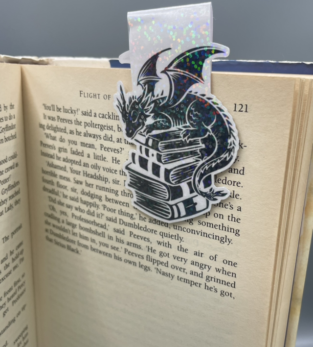 Dragon sitting on books