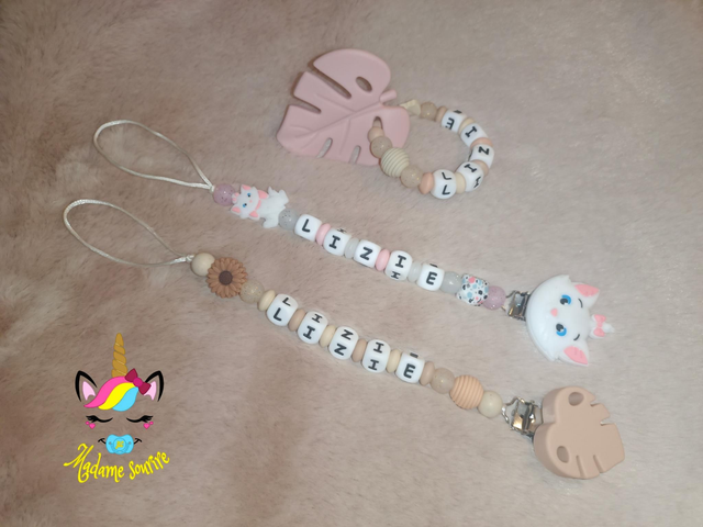 1 Attache tétine Idole + 1 Attache tétine + 1 Hochet petit