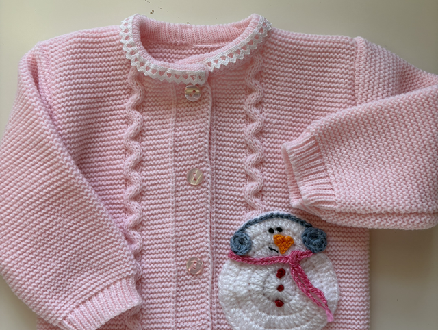 Casaco rosa com boneco de neve 