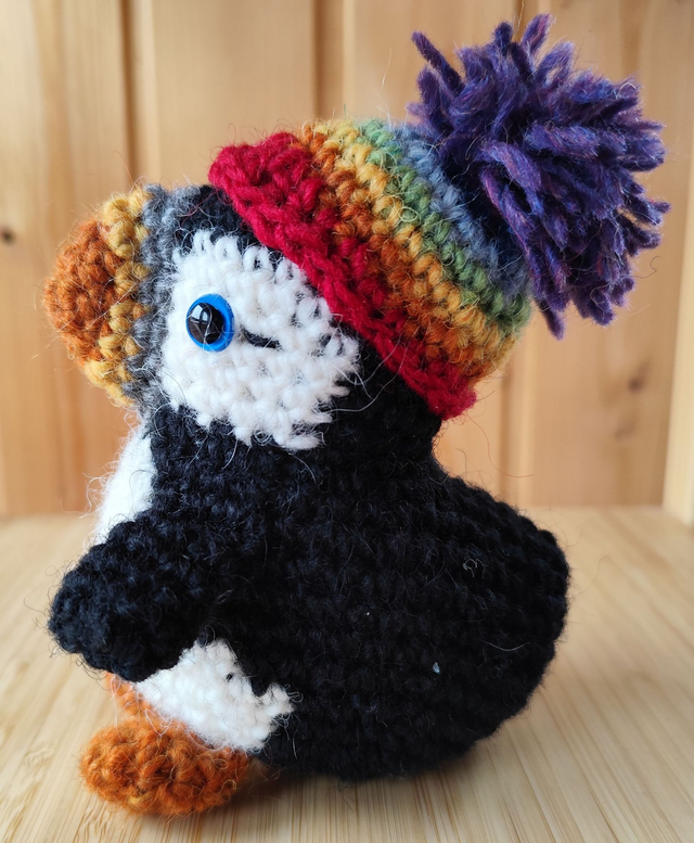 Dotty the puffin with rainbow hat, medium size (made from Icelandic wool yarn)