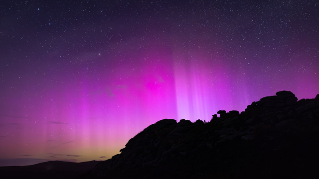 Northern Lights at Ingra Tor, Dartmoor, Devon. A6 photographic greeting card. Blank inside for your own message.