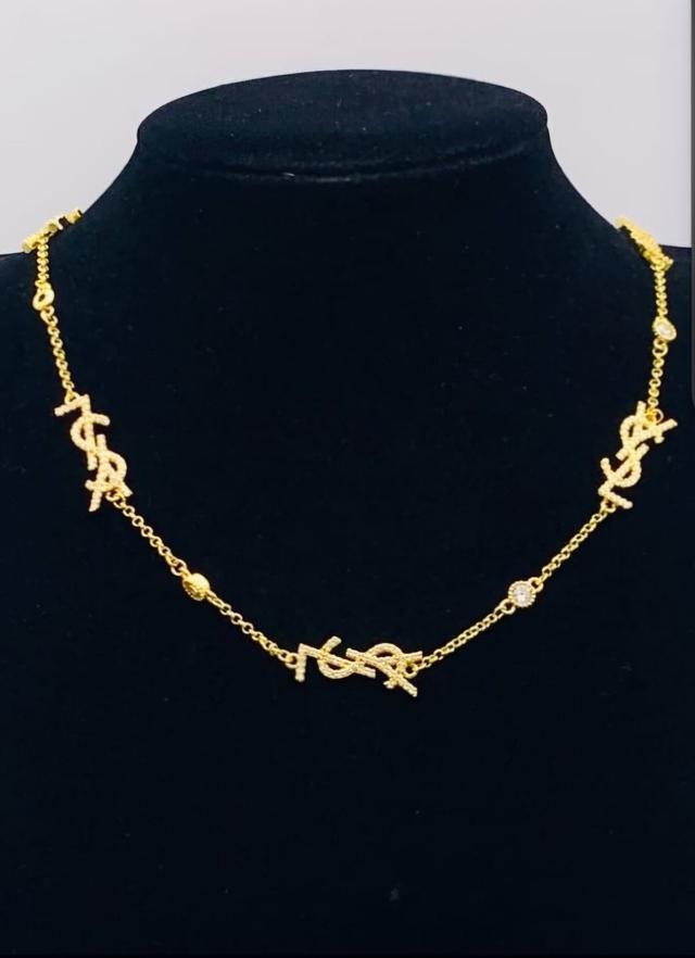 Colliers YSL doré 