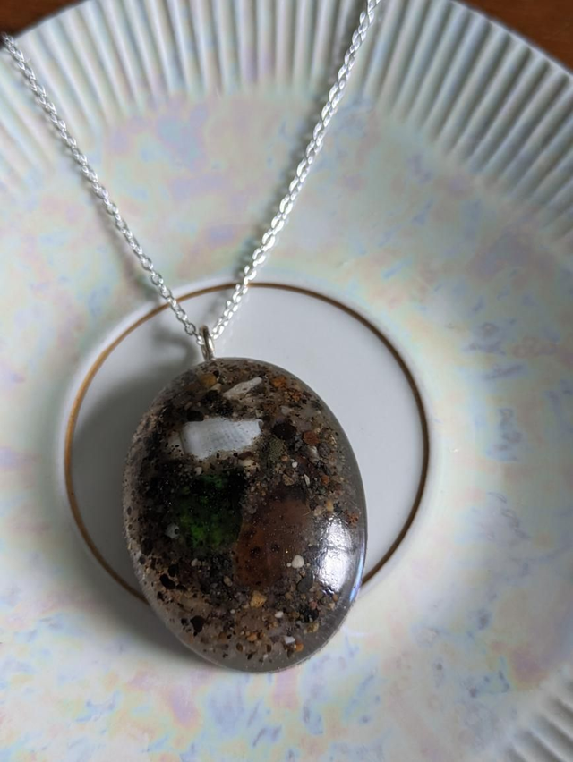Resin necklace filled with sand and sea glass 