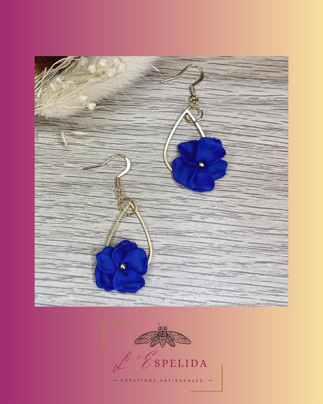 Petite goutte dorée avec fleurs bleues et dorées 