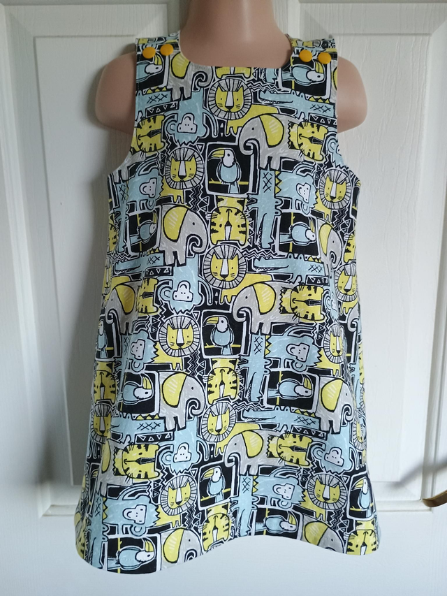 Dress - 2 yrs (92 cm).   Blue/grey/yellow animals
