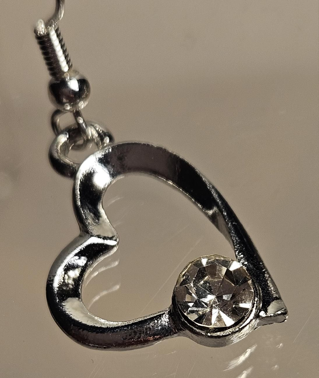 Off centre crystal heart earrings 