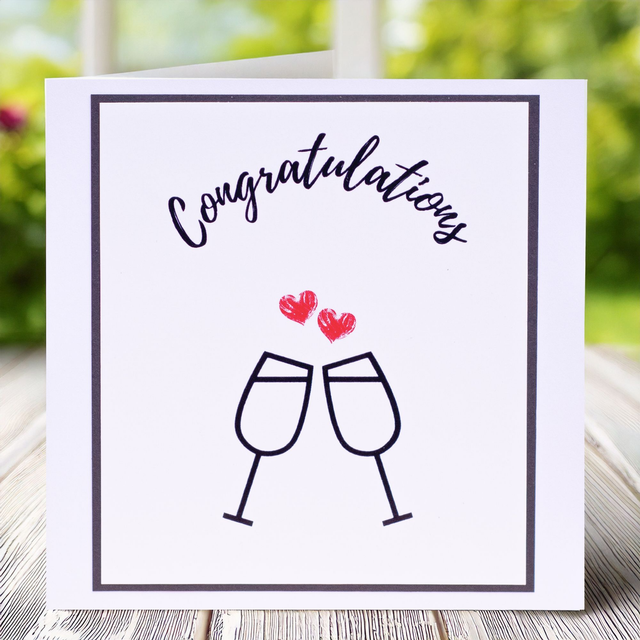 Engagement, Congratulations card in black and white with two red hearts. 135mm x 135mm.