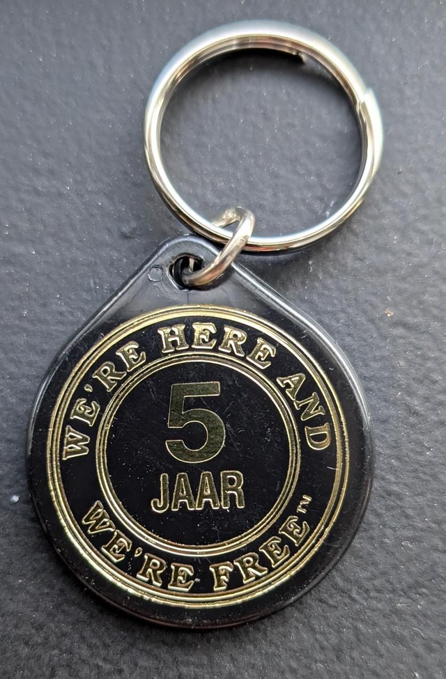 5 jaar plactic coin 