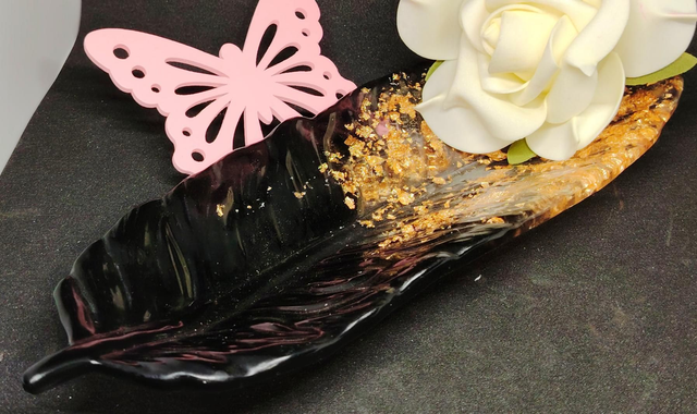 Vide poche plume golden black