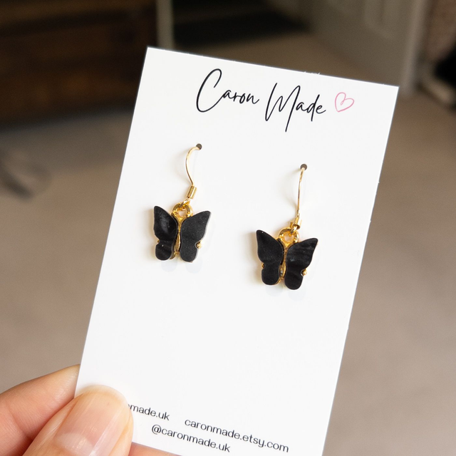 Butterfly charm earrings - black and gold 