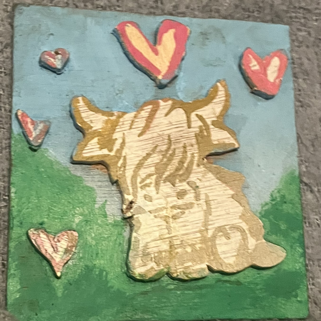 Highland cow with love hearts around it number 16