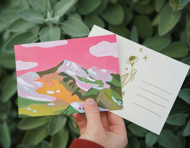 green mountain with pink sky postcard