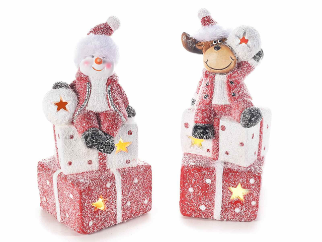 Personaggio natalizio ceramica su pacchetti regalo con luce