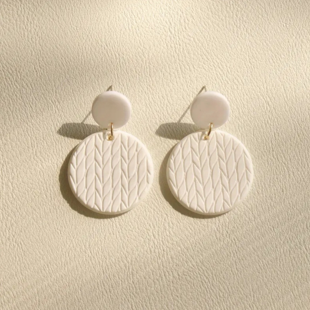 White disc dangles
