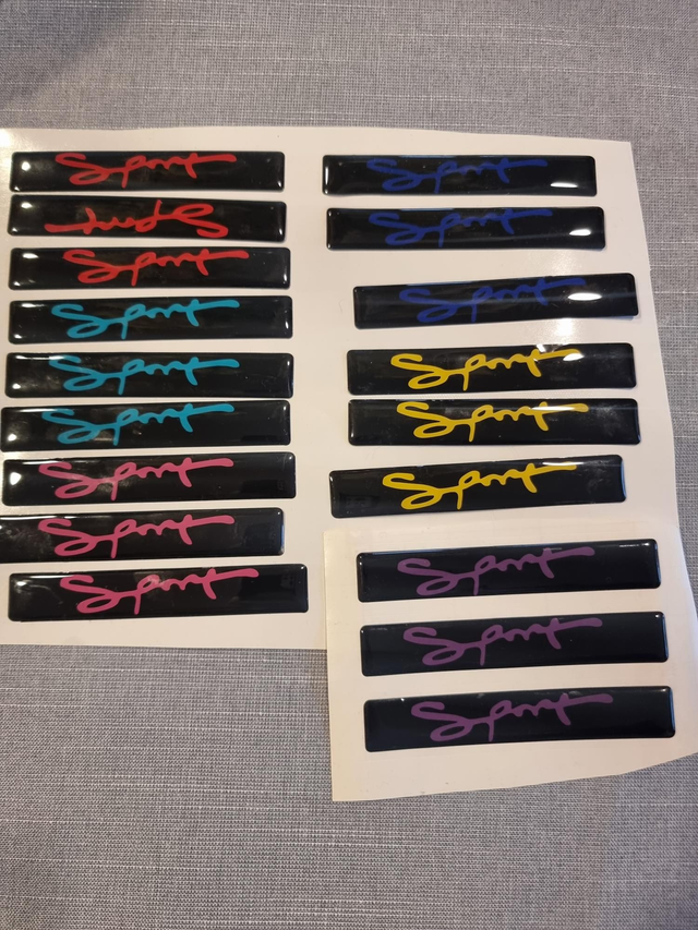 Coloured sport grill badges