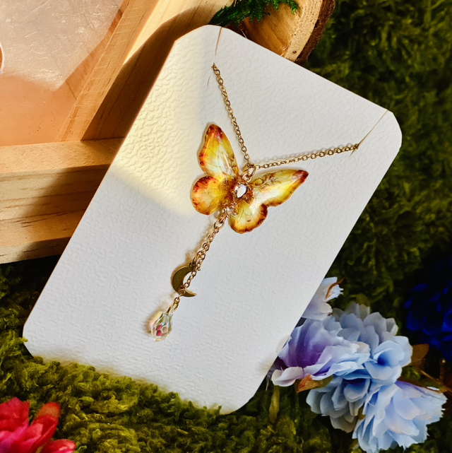 Papillon soleil couchant collier