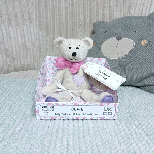 Jovie. Small size, handmade teddy bear. UKCA. Tray base packaging. Standard Wool Felt. Beige. Pastel rainbow. Rose Pink. Lavender. Lilac. Purple.
