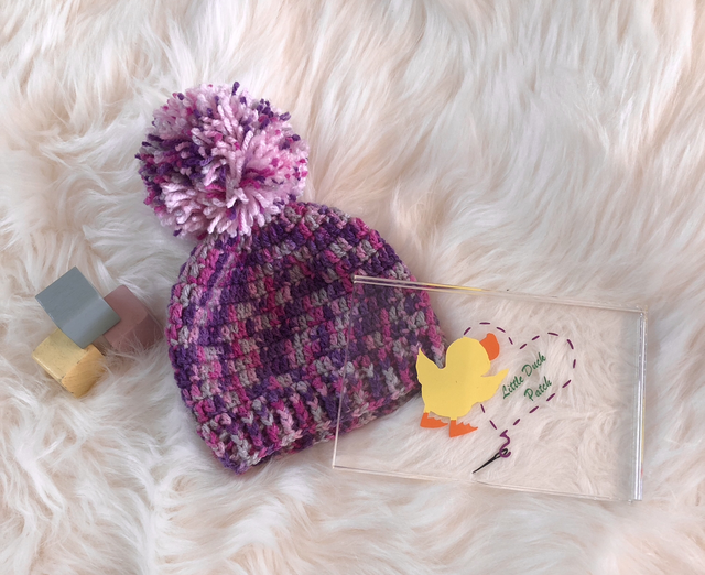 Purple and pink Pom Pom hat