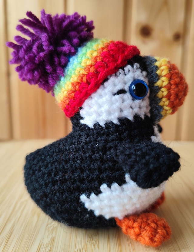 Fluffy the puffin with rainbow hat, small size (made from merino wool yarn)