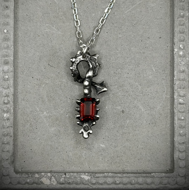 Garnet Skeletal Form pendant necklace