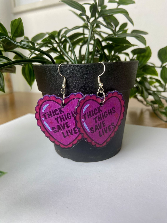 Thick thighs save lives earrings.