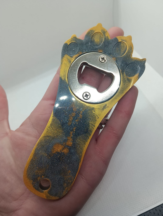 Décapsuleur pate gris et or 