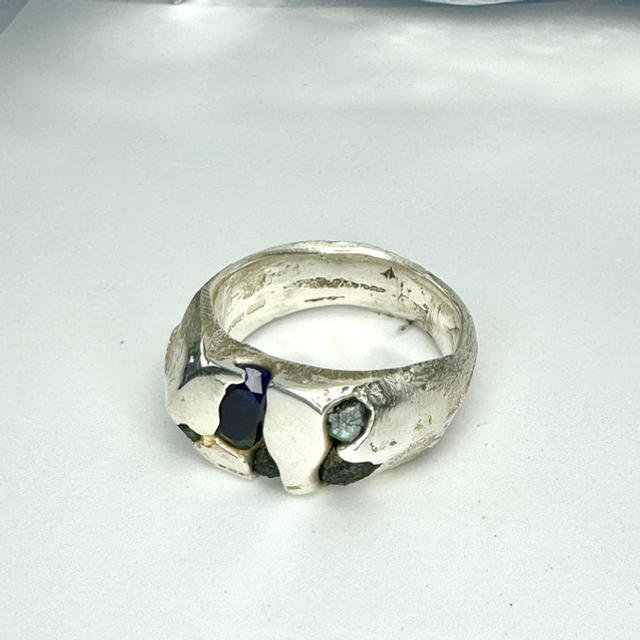 Sand cast emerald and sapphire ring