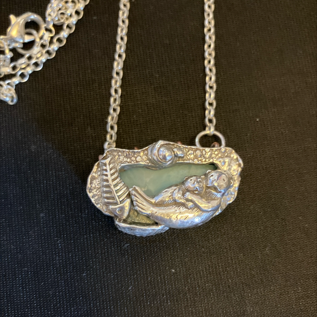 Otter and baby with larimar stone