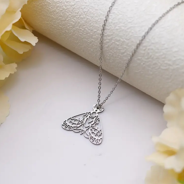 Cut out moth necklace