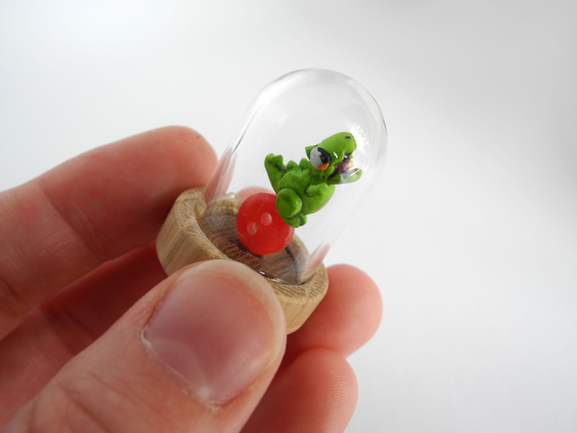 Grumpy dinosaur in a glass dome - miniature pendant in collaboration with @minidinosaur_comics