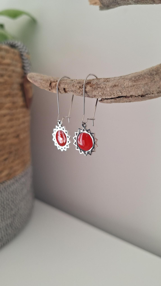 Boucles d&#039;oreilles soleils rouges